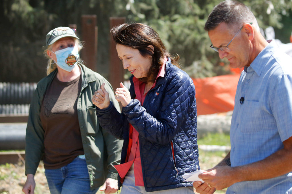 From left, Logan Daniels, Snohomish County Parks and Recreation lead engineer, U.S. Sen. Maria Cantwell and Tom Teigen, Snohomish County Conservation and Natural Resources director, tour the estuary restoration project Friday at Meadowdale Beach Park in Edmonds. (Kevin Clark / The Herald)
