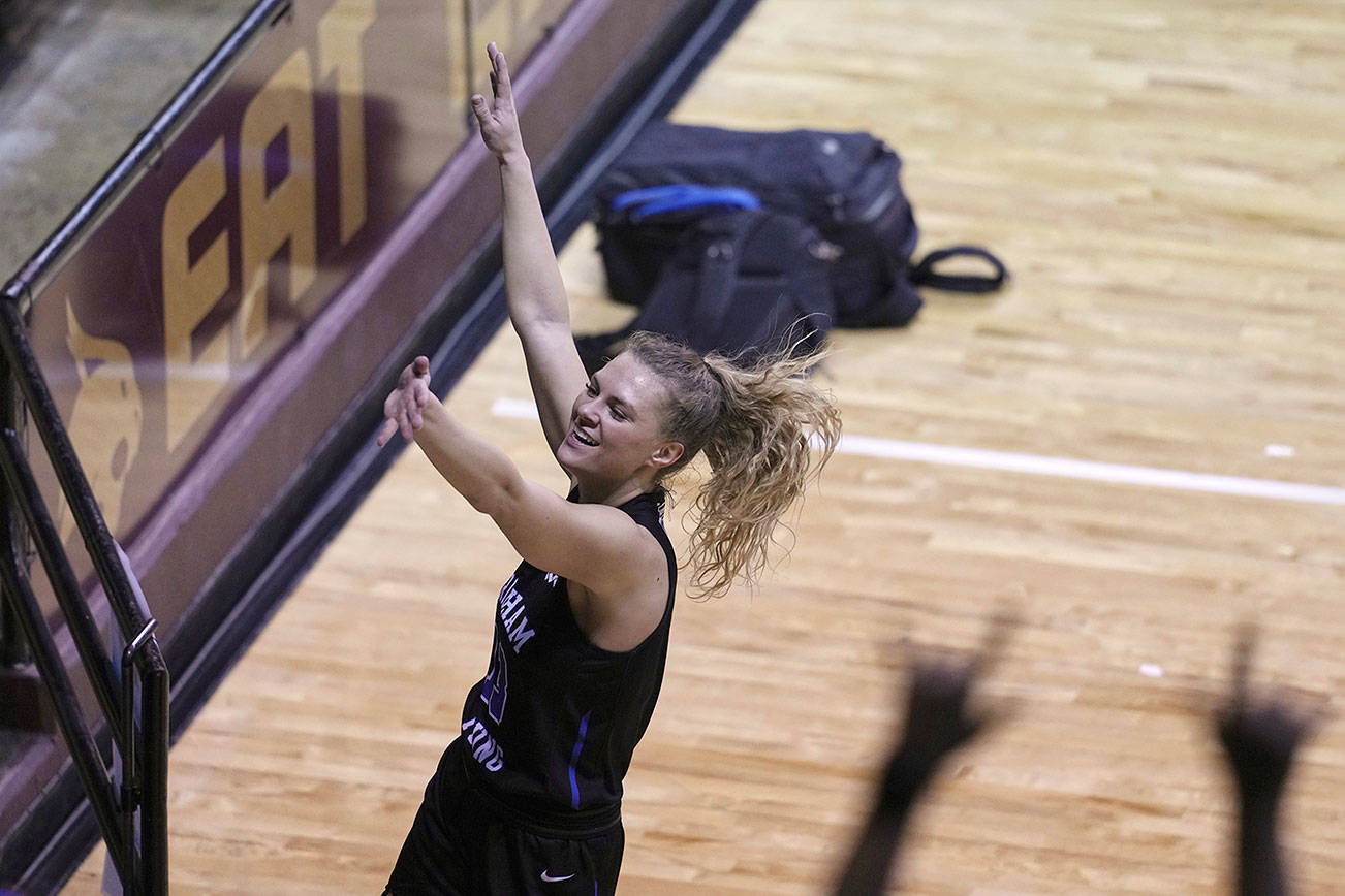 BYU's Paisley Harding (13) looks toward fans as she celebrates after BYU defeated Rutgers in a college basketball game in the first round of the women's NCAA tournament at the University Events Center in San Marcos, Texas, Monday, March 22, 2021. BYU defeated Rutgers 69-66. (AP Photo/Chuck Burton)
