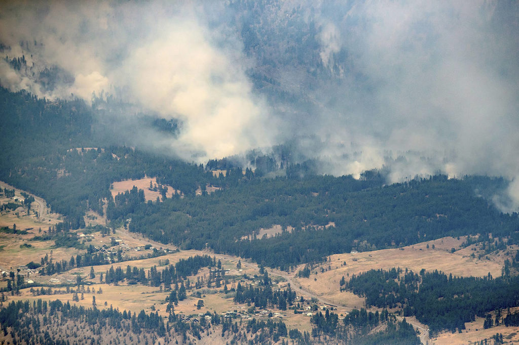 In this July 1 photo, a wildfire burns in the mountains north of Lytton, British Columbia, Canada, during record high temperatures. (Darryl Dyck/The Canadian Press via AP, File)
