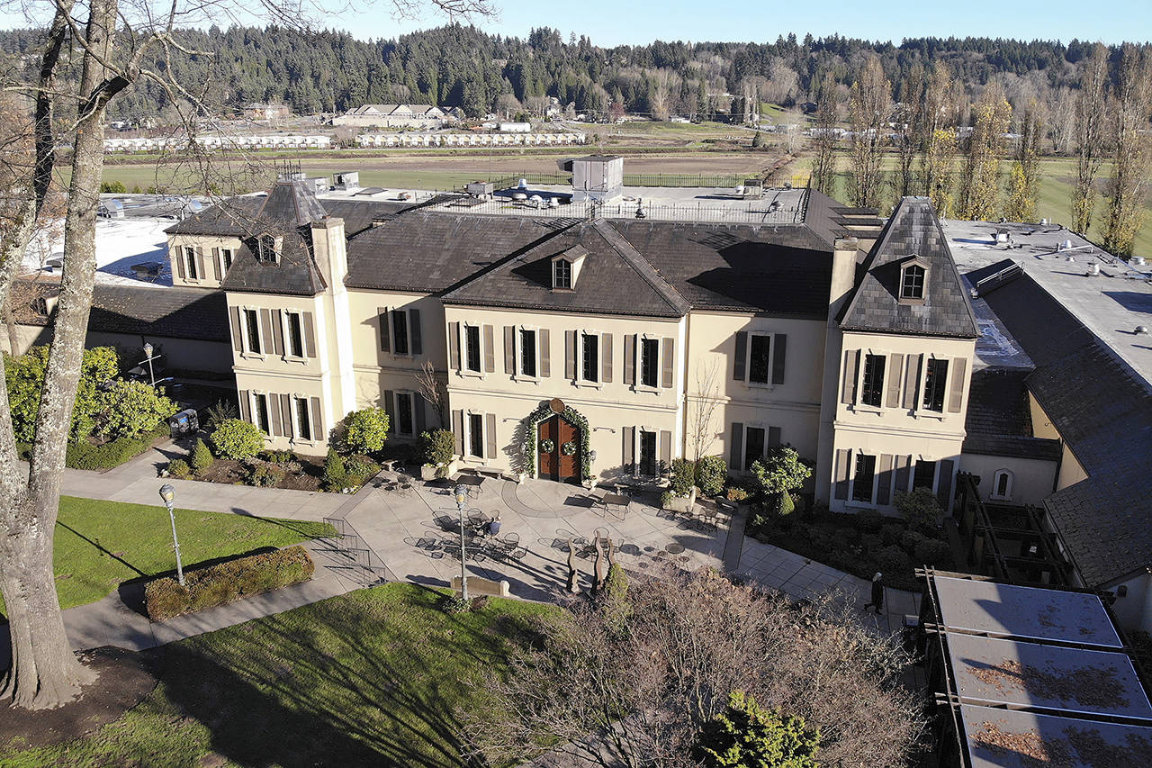 In this 2019 photo, the French-style inspired main building of the Chateau Ste. Michelle winery is seen in Woodinville. (AP Photo/Elaine Thompson, file)