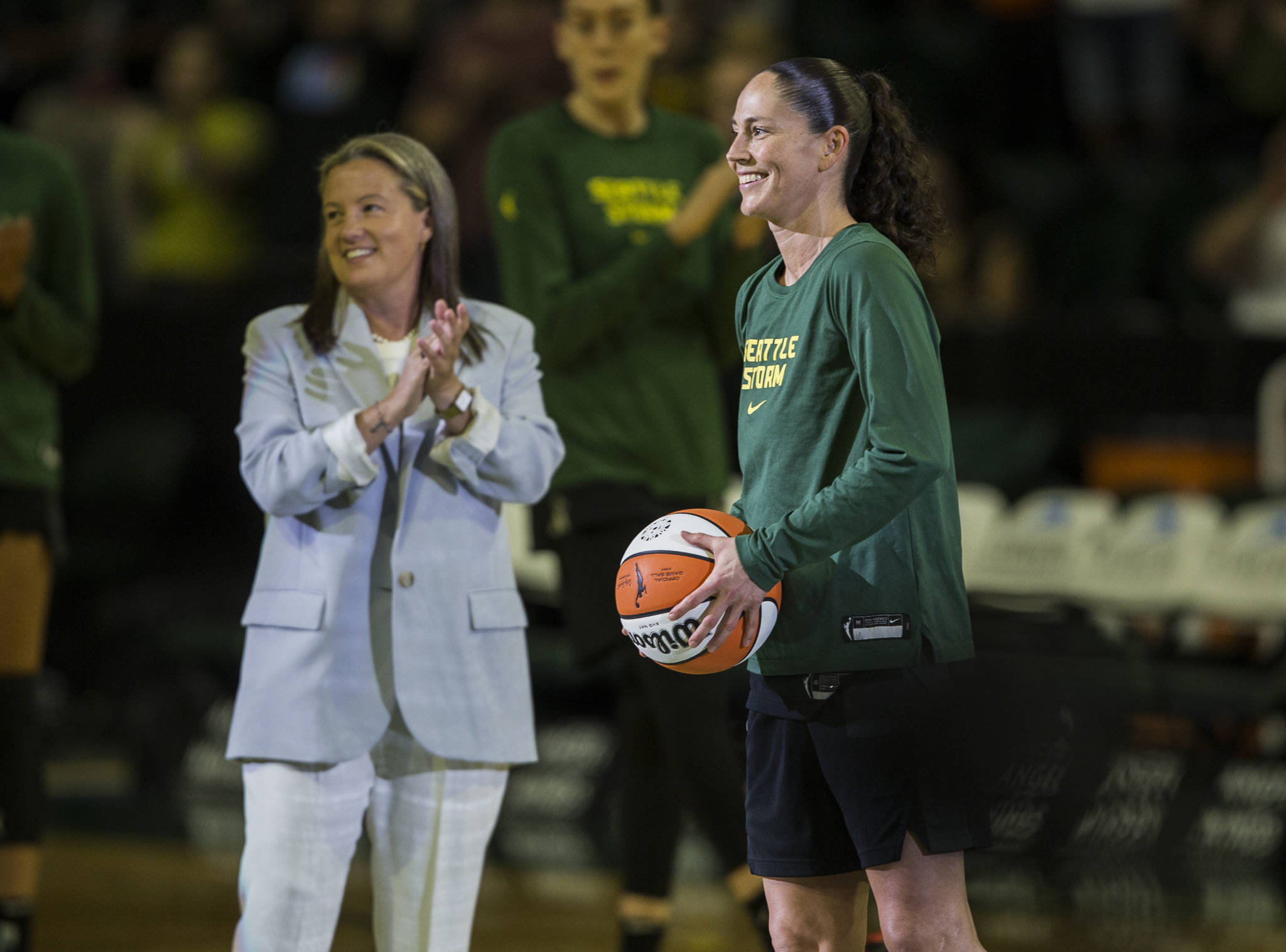 Seattle Storm’s Sue Bird receives a basketball honoring her achievement of becoming the only player in league history to amass 3,000 career assists on Sunday, July 11, 2021 in Everett, Wash. (Olivia Vanni / The Herald)