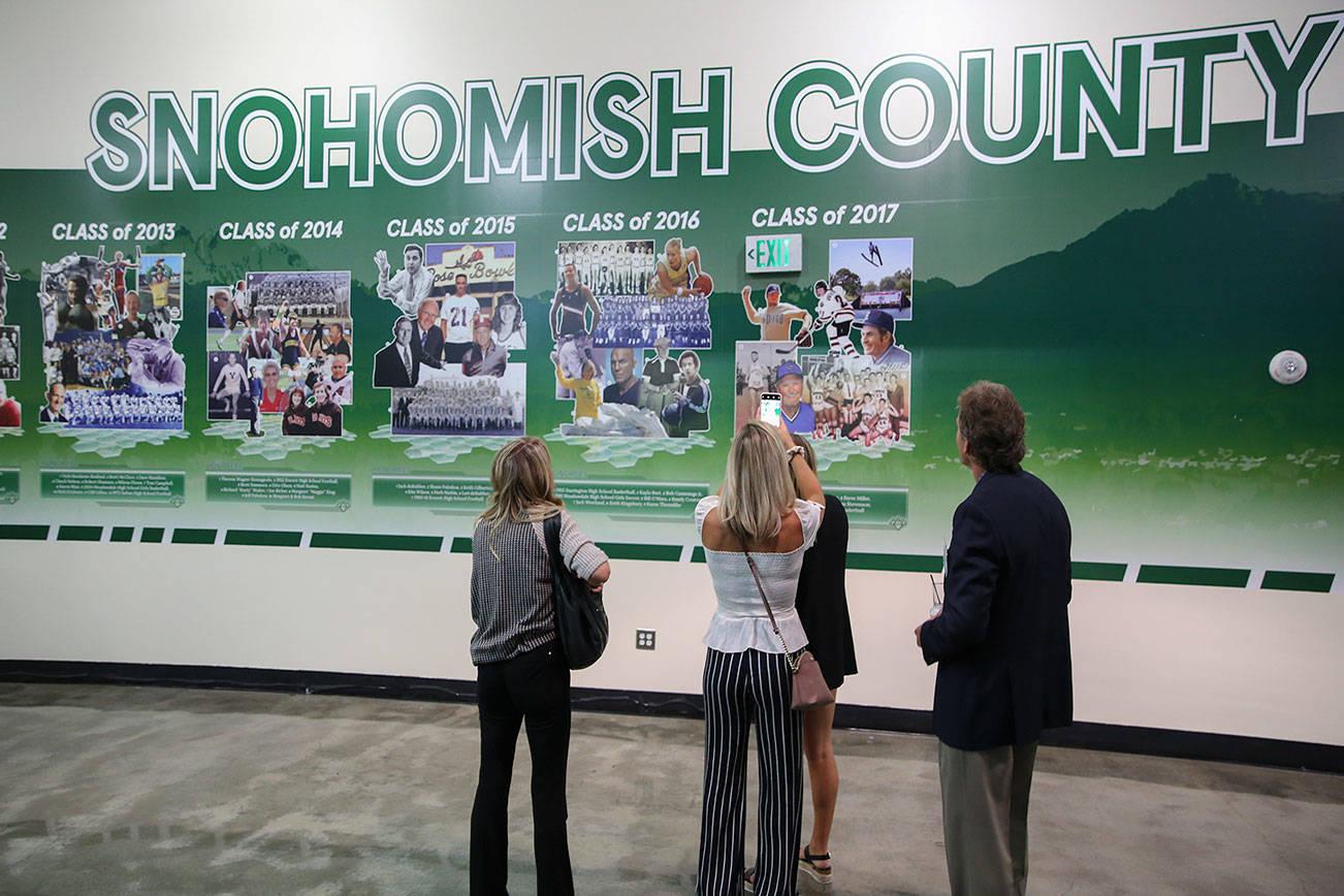 Attendees take in the Snohomish County Sports Hall of Fame during the Tenth Annual Snohomish County Sports Hall of Fame Banquet Wednesday evening at Angel of the Winds Arena in Everett on September 18, 2019.  (Kevin Clark / The Herald)