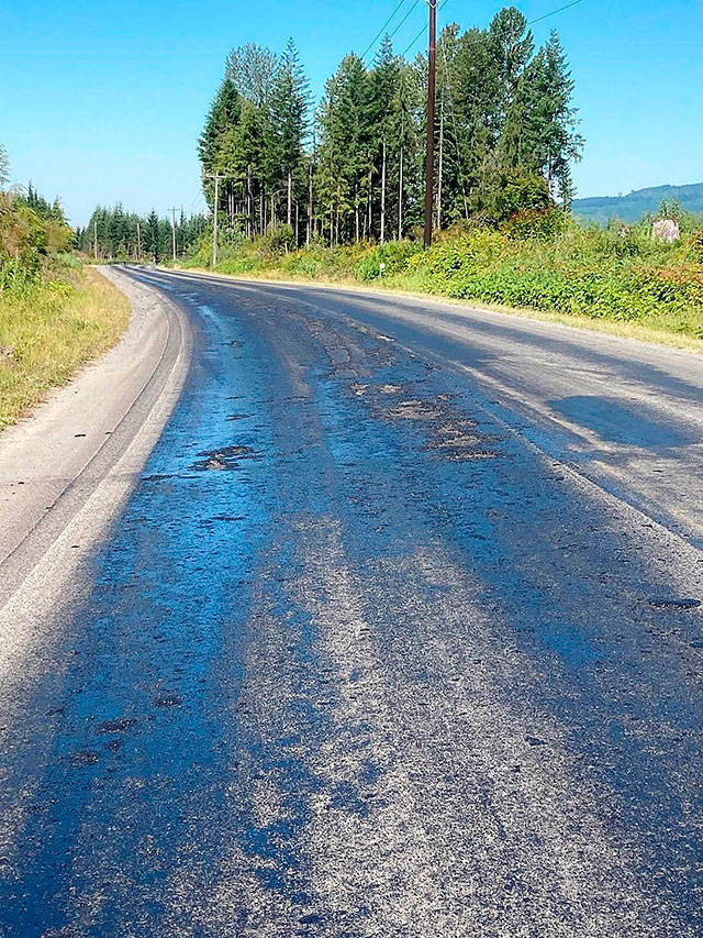 When the high temperatures in late June damaged stretches of the Mountain Loop Highway, Snohomish County Public Works treated it with water-cooled sand that served as a binder for the asphalt emulsion to then re-harden the surface. (Snohomish County Public Works)