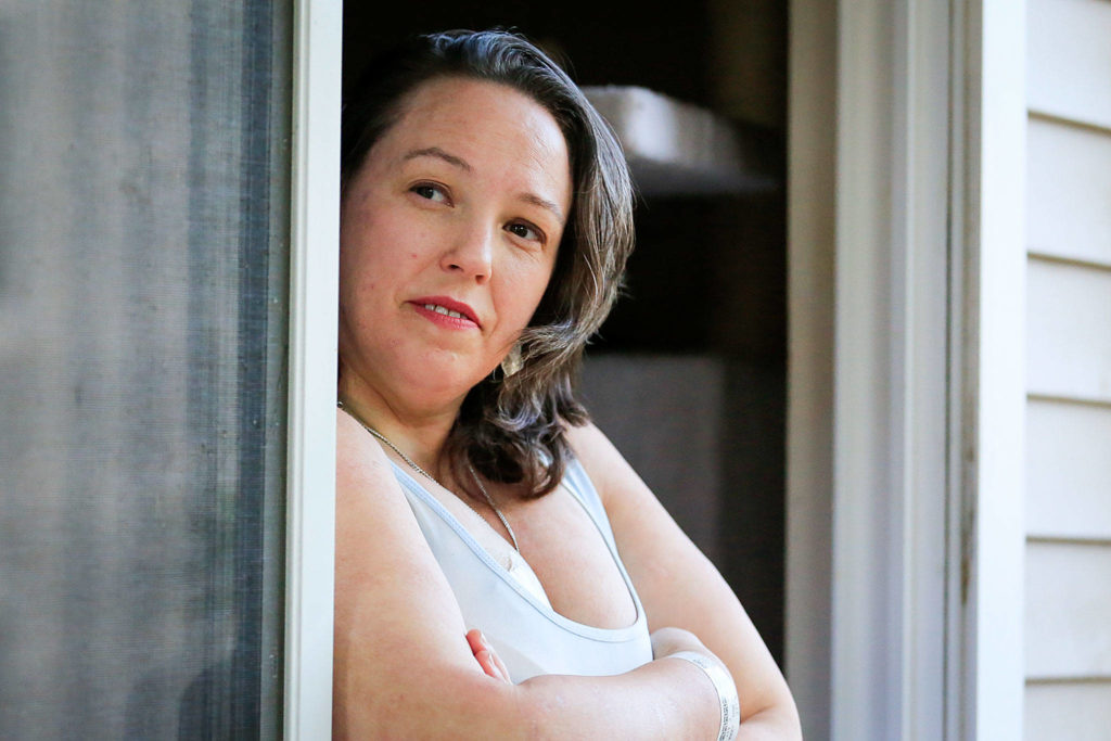 Hilary Lohman must vacate her home in the Whispering Pines Apartments complex by Aug. 31. The building is slated to be demolished in October. (Kevin Clark / The Herald)
