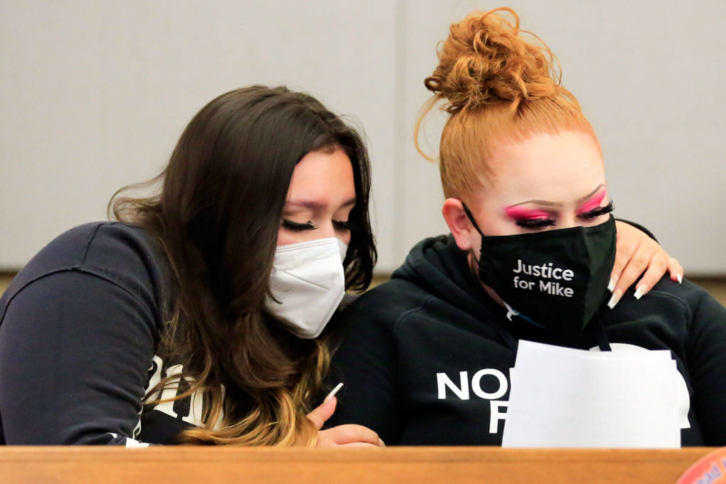 Nevaeh Smith (left), niece of murder victim Michael Smith, and Shuston Smith, Michael Smith’s sister, embrace at the sentencing of Jesse Engerseth Tuesday at the Snohomish County Courthouse in Everett. (Kevin Clark / The Herald)
