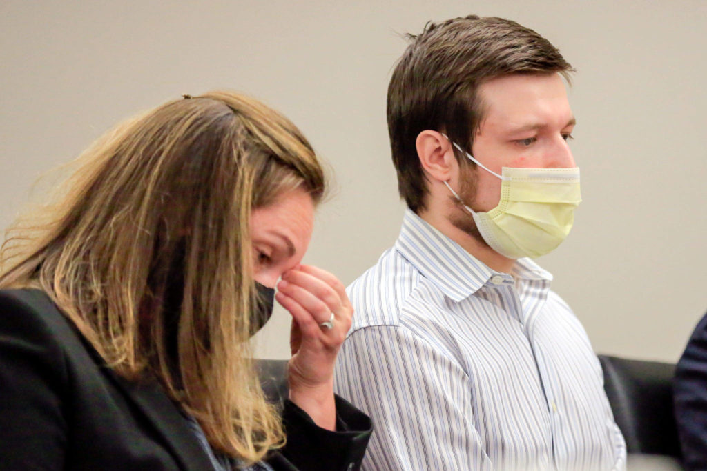 Defense attorney Kathryn Fraser (left) listens with Jesse Engerseth during his sentencing for the murder of Michael Smith at the Snohomish County Superior Courthouse on Tuesday. (Kevin Clark / The Herald)
