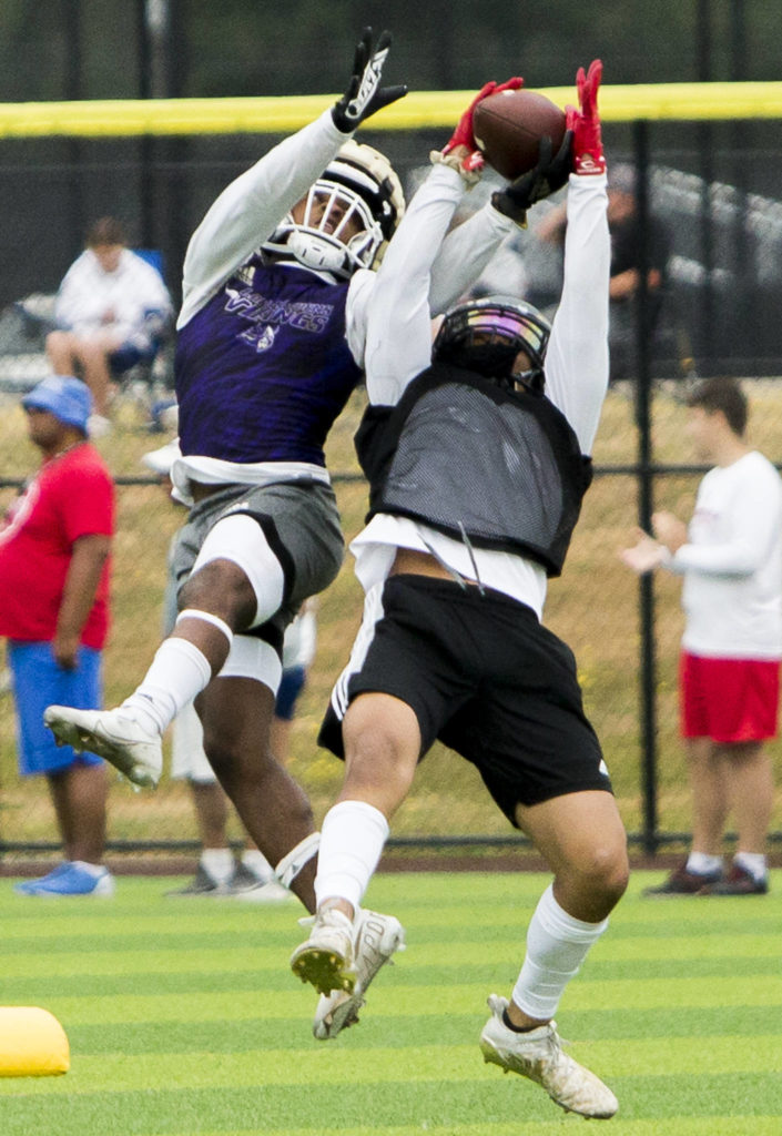 Lake Steven’s Trayce Hanks blocks a pass during the Cougars Championship Passing Tournament at Lakewood High School on July 31 in Arlington. (Olivia Vanni / The Herald)