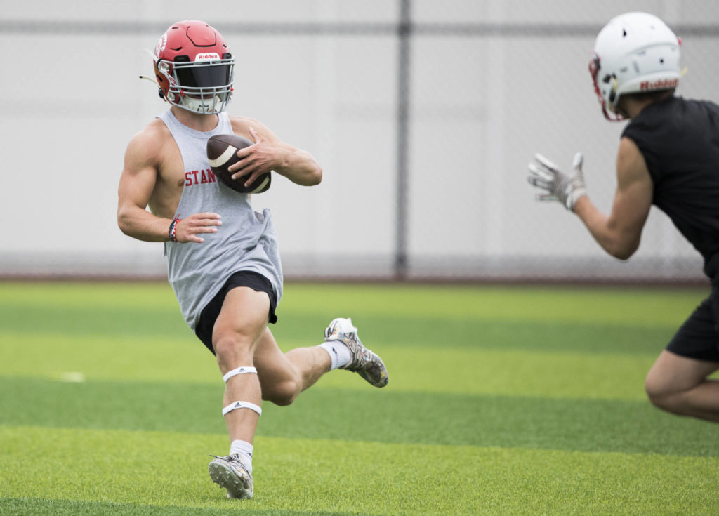 Stanwood’s Ryder Bumgarner runs the ball in for a touchdown during the Cougars Championship Passing Tournament at Lakewood High School on July 31 in Arlington. (Olivia Vanni / The Herald)