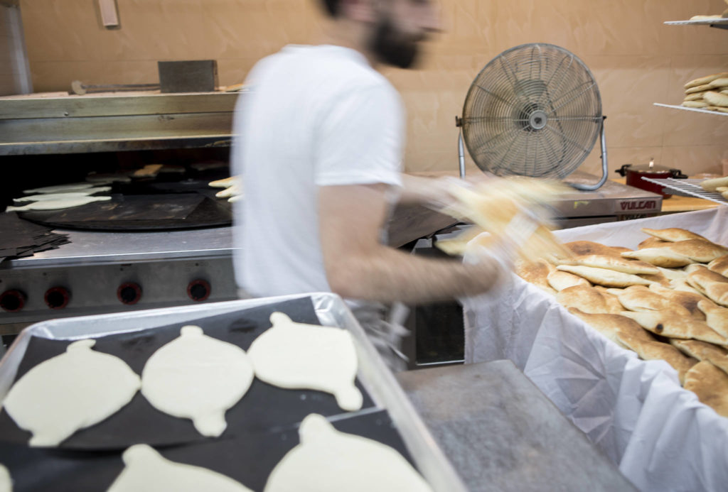 Fresh pita bread at Alida’s Bakery in Everett. (Olivia Vanni / The Herald)
