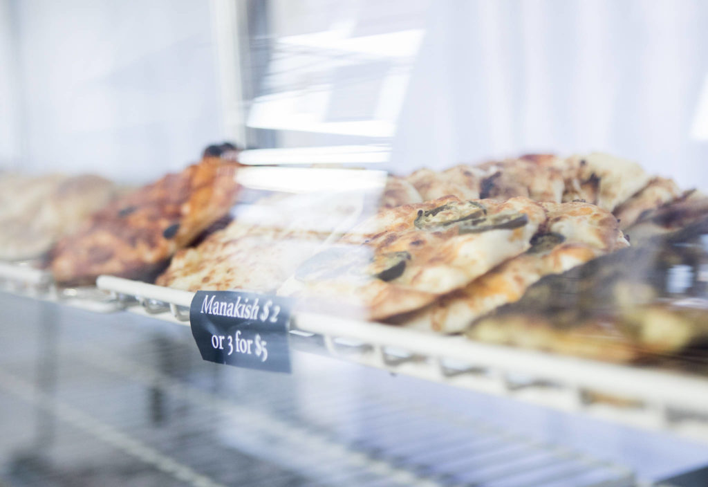 Fresh manakish, a type of flatbread with toppings, at Alida’s Bakery in Everett. (Olivia Vanni / The Herald)
