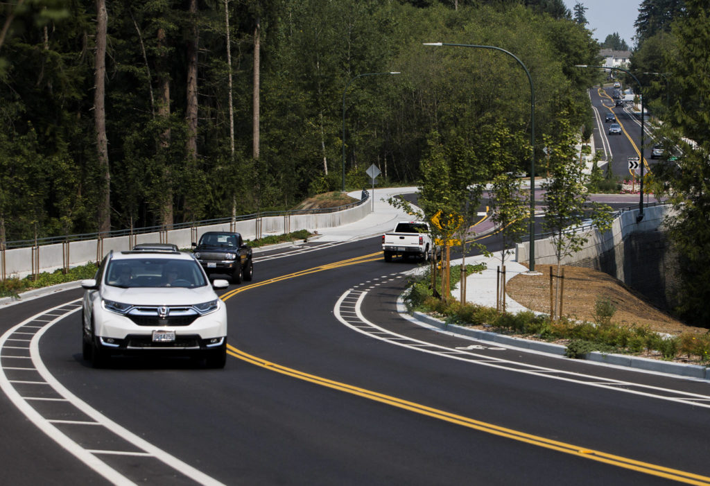 Cars drive along Harbour Reach Drive on Thursday. The $18 million road has sidewalks and bike lanes that parallel a 0.70-mile stretch of Highway 525/Mukilteo Speedway. (Olivia Vanni / The Herald)
