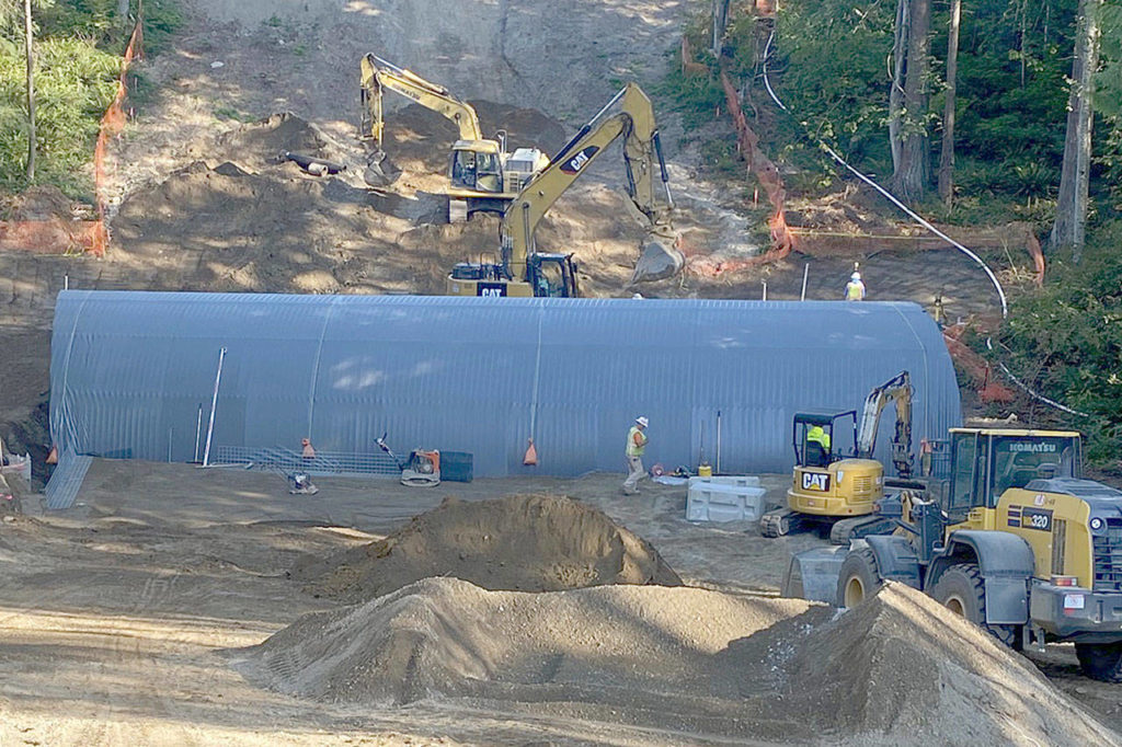 People work on a large pipe culvert for fish and wildlife passage at the base of Harbour Reach Drive, a new road that provides a vital north-south parallel to Highway 525. (City of Mukilteo)
