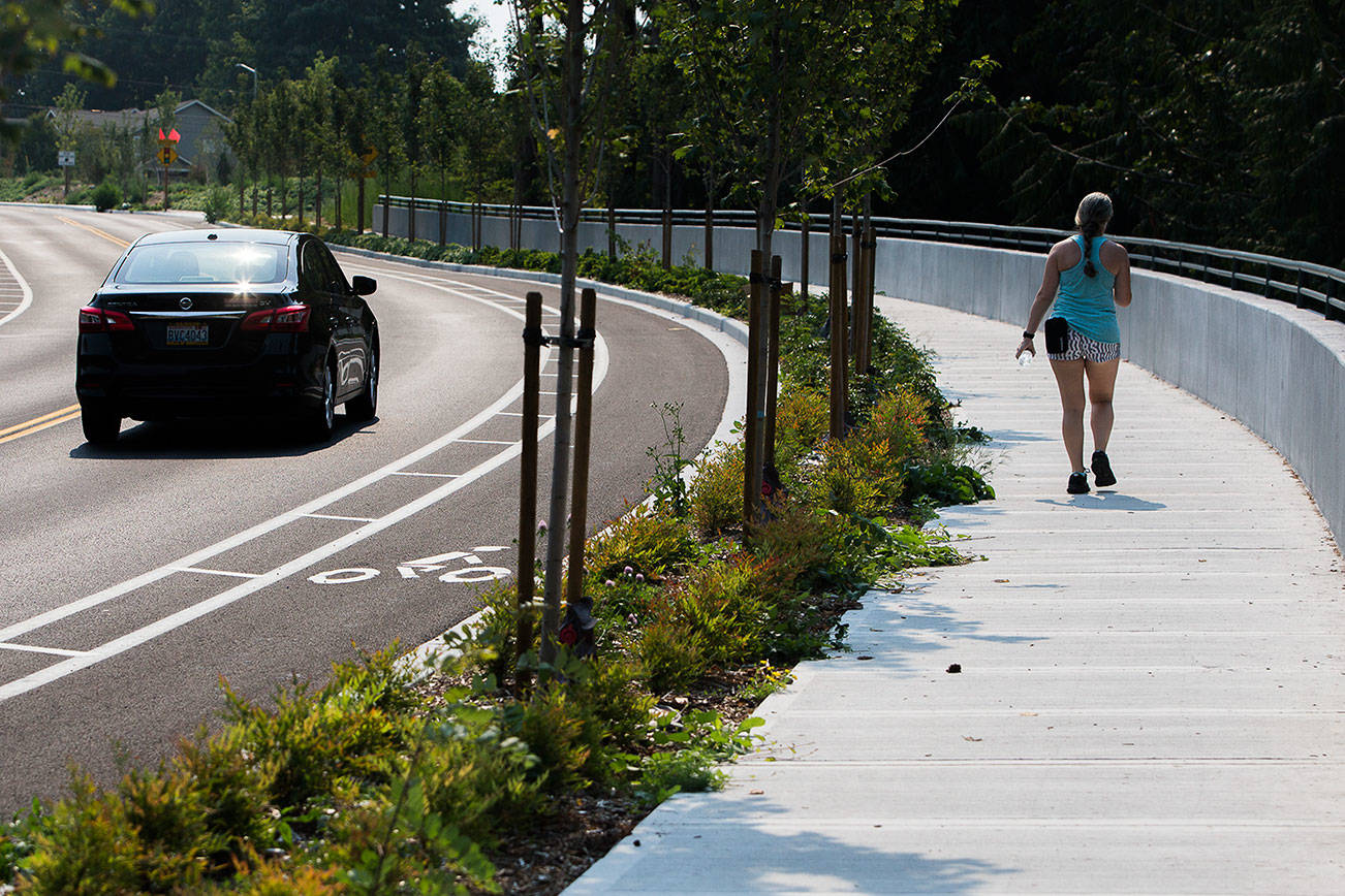 Cars and pedestrians use the newly opened Harbour Reach Drive on Thursday, Aug. 12, 2021 in Mukilteo, Wash. (Olivia Vanni / The Herald)