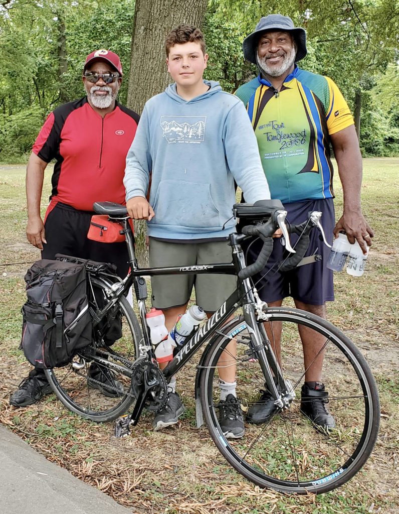 Deven Boyce (center), 14, met many fellow bicyclists along the way. This was in College Park, Maryland. (Submitted photo) 
