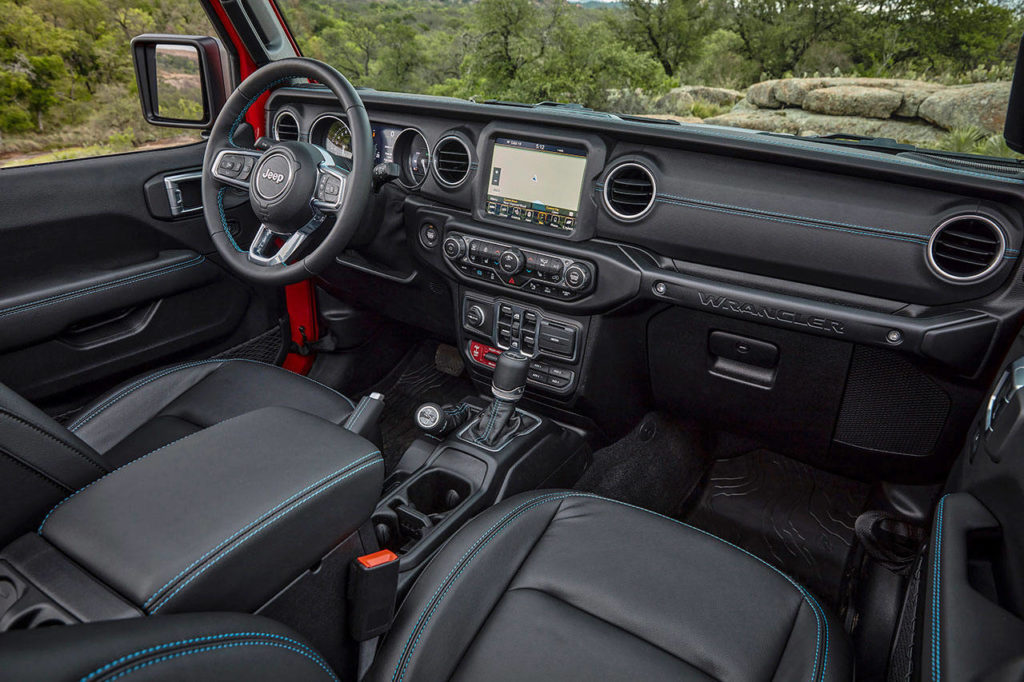 The 2021 Jeep Wrangler 4xe interior shows signs of new tech, but styling is pure Jeep. The Rubicon interior is shown here. (Manufacturer photo)
