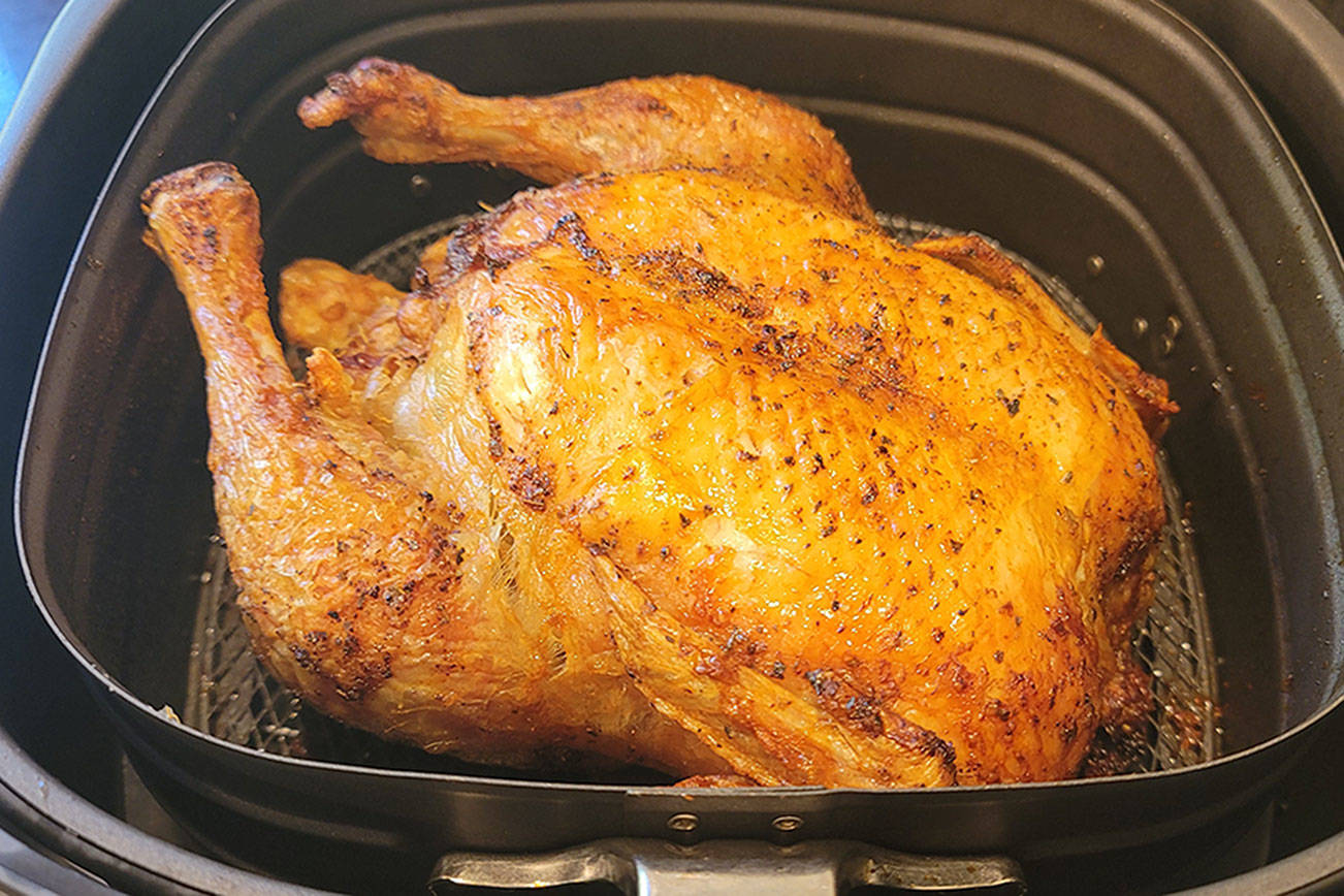 Can an air fryer replicate rotisserie chicken? Seventy minutes at 375 degrees comes pretty darn close. (Jennifer Bardsley)