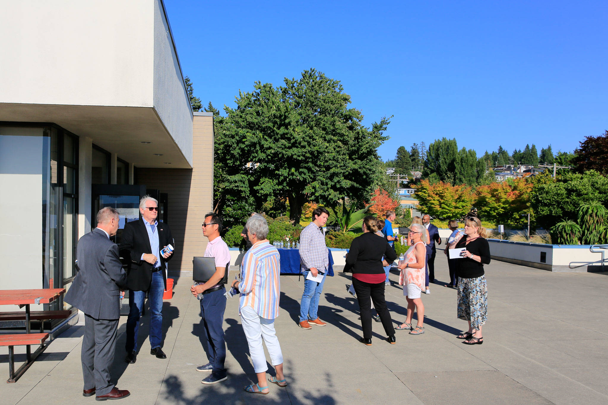 Edmonds police chief finalists talk with residents Wednesday during a meet-and-greet at the Edmonds Library. (Kevin Clark / The Herald)