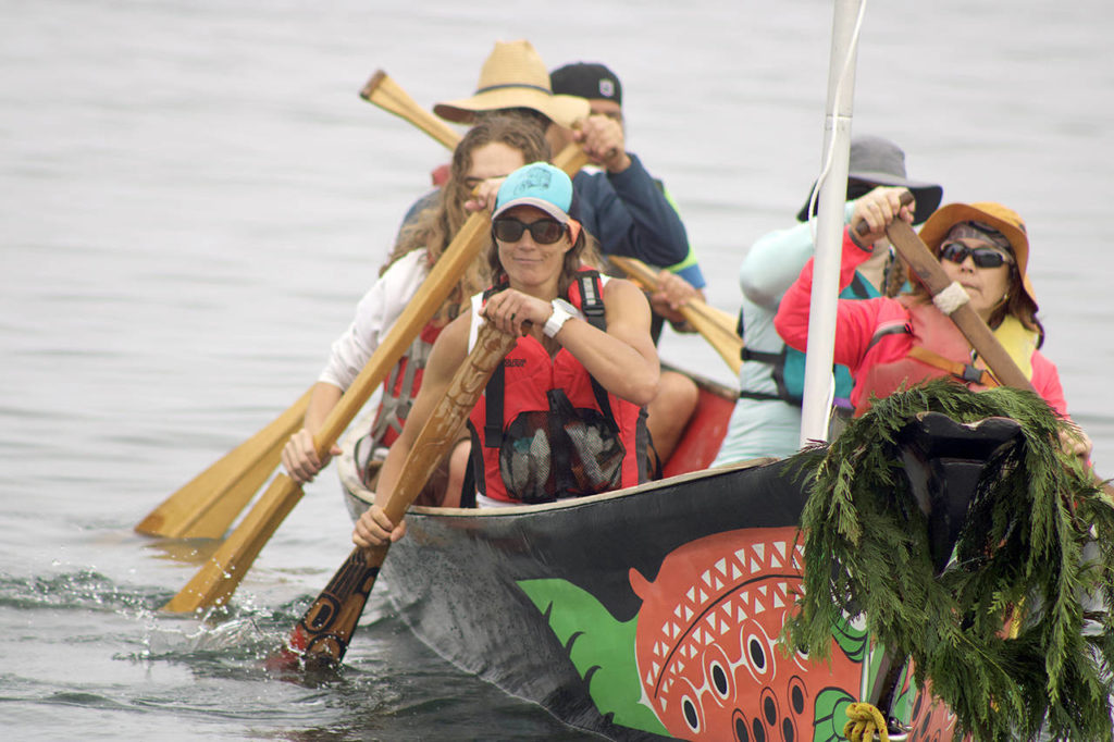 Paddlers begin their two-week journey to Lummi Island with the Blue Heron Canoe Family on Monday morning. (Isabella Breda / The Herald)
