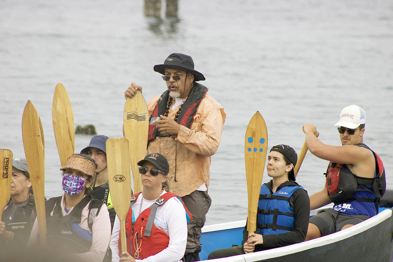 Mike Evans, Blue Heron Canoe Family patriarch, asks permission to navigate the Coast Salish waters as paddlers prepare to depart on their two week journey to Lummi Island. (Isabella Breda / The Herald)