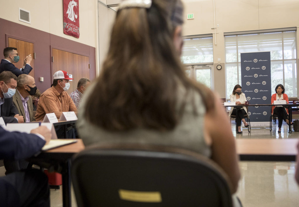 Local farmers and officials meet with U.S. Trade Representative Katherine Tai and U.S. Reps. Suzan DelBene and Rick Larsen in Mount Vernon on Thursday. (Olivia Vanni / The Herald)
