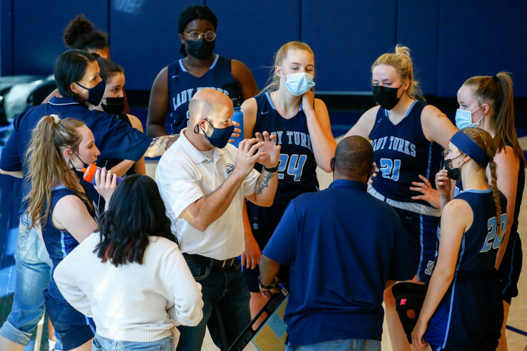 Todd Weideman, Sultan head coach, leads a time out during a game at Eastside Prep in Kirkland on June 17. (Kevin Clark / The Herald)
