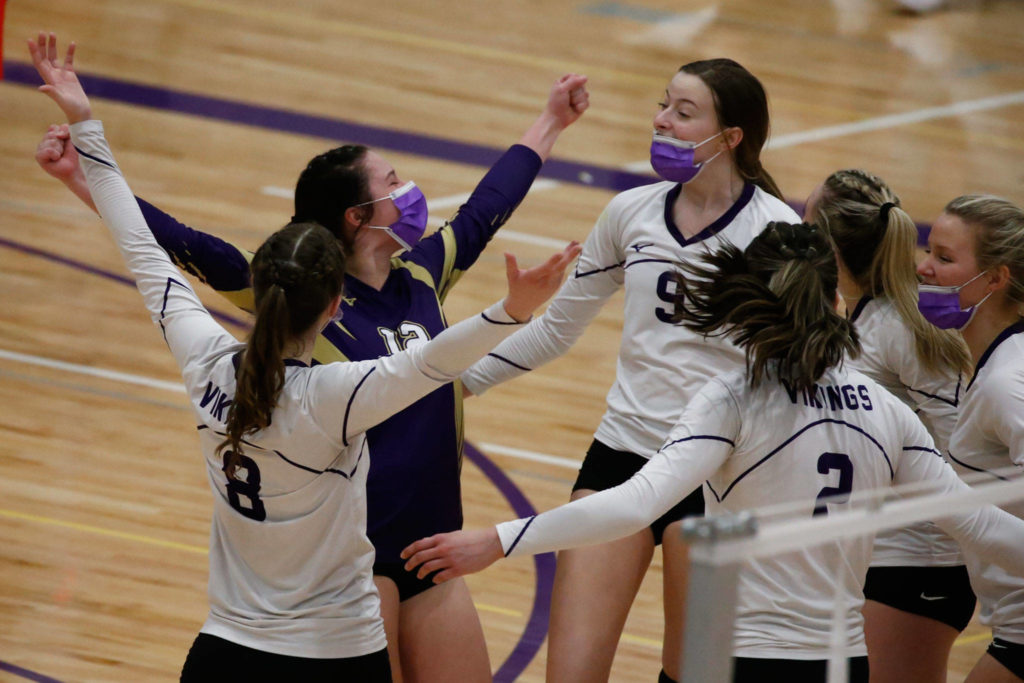 Lake Stevens players celebrate during a match against Snohomish on March 25 at Lake Stevens High School.(Kevin Clark / The Herald)
