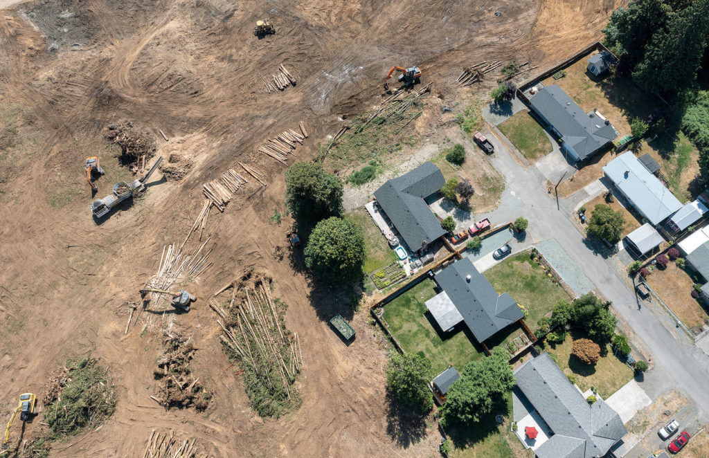 Houses at the end of the 2100 block of 93rd Drive SE in Lake Stevens used to front a forest. Now the property has been clearcut to make way for a new Costco store near the intersection of Highway 9 and 20th Street SE. (Chuck Taylor / The Herald)
