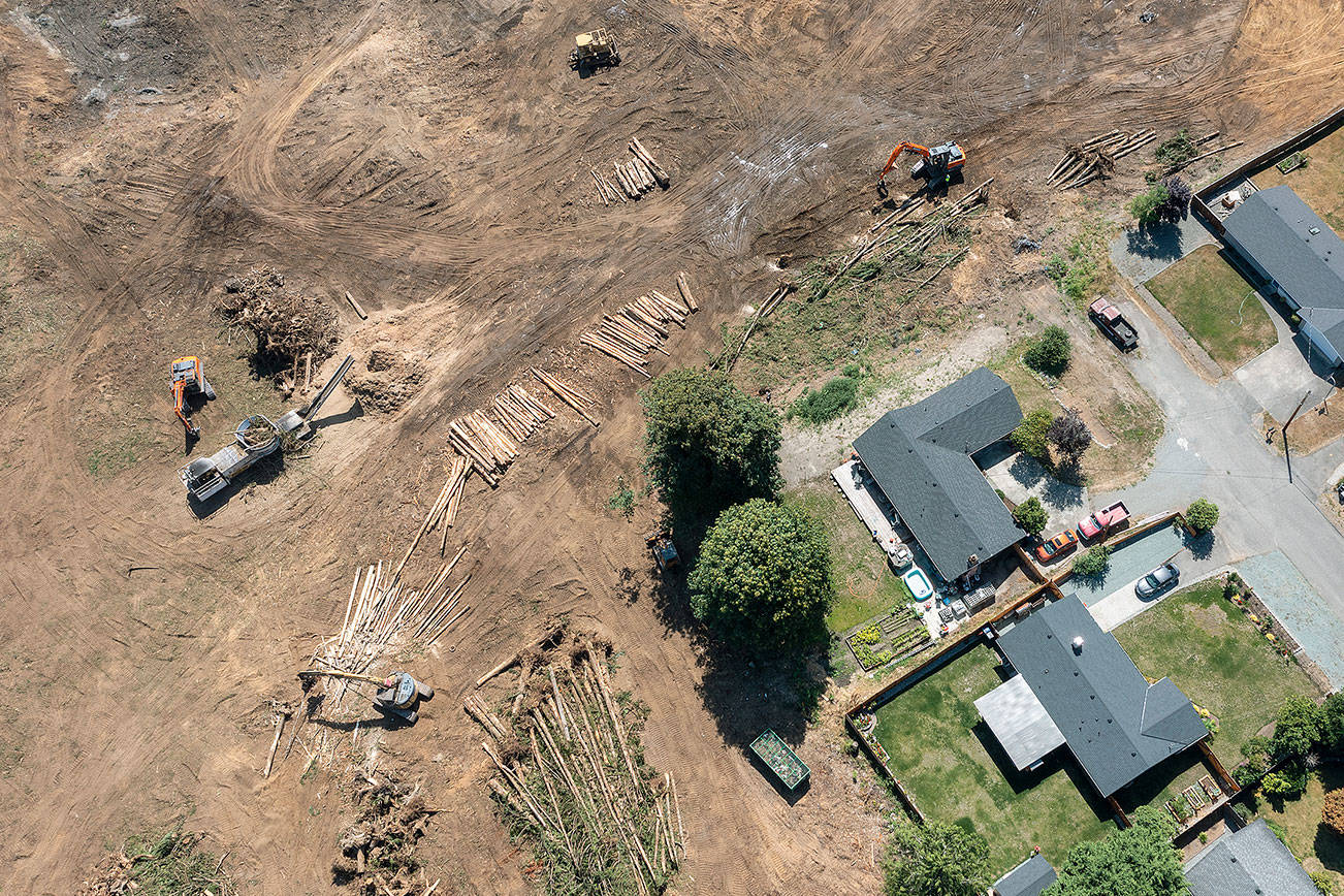 Houses at the end of the 2100 block of 93rd Drive SE in Lake Stevens used to front a forest. Now the property has been clearcut for the new Costco store near the intersection of Highway 9 and 20th Street SE. (Chuck Taylor / The Herald) 20210810