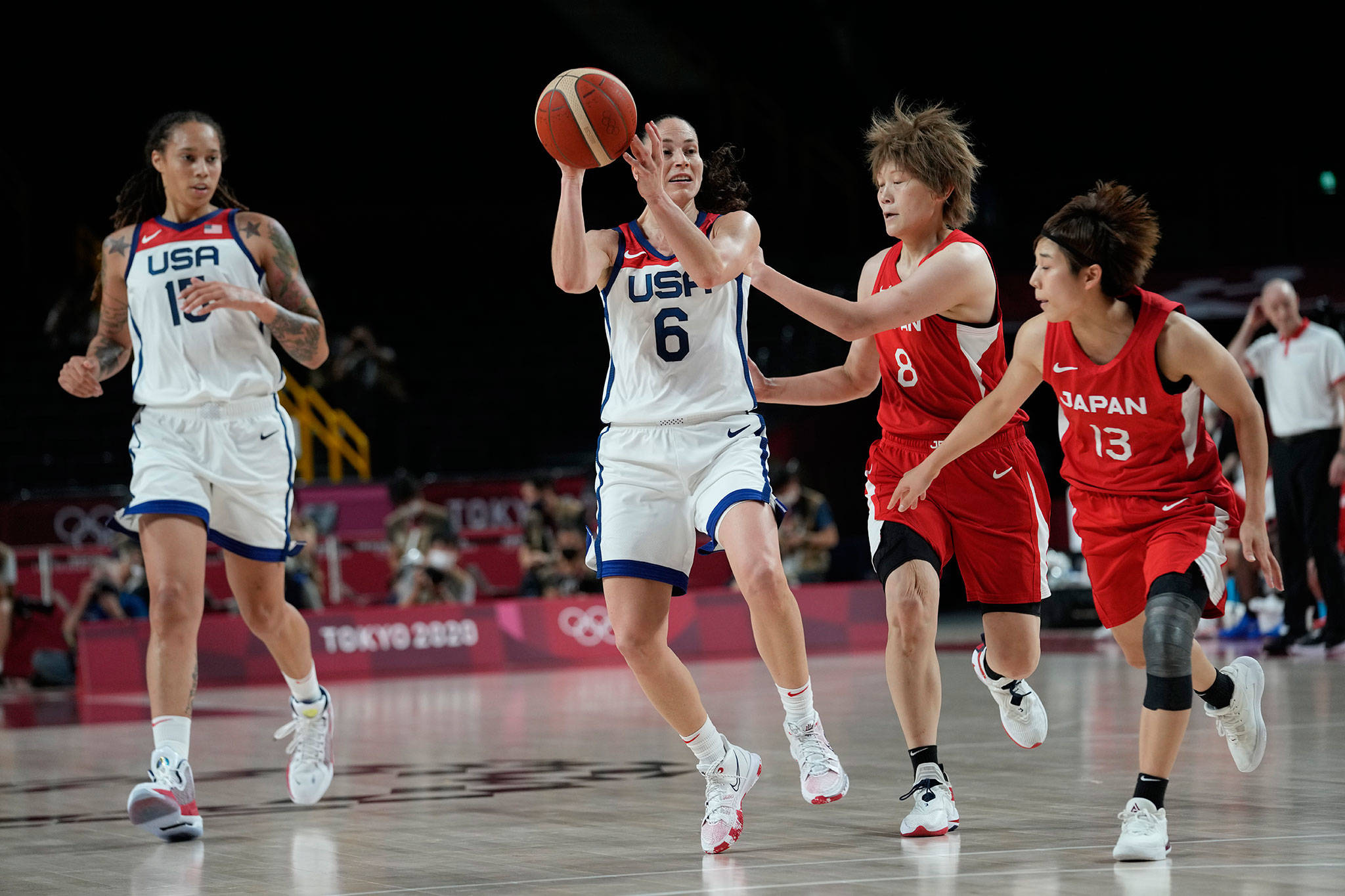 The United States’ Sue Bird (6) drives past Japan’s Maki Takada (8) and Rui Machida (13) during women’s basketball gold medal game at the 2020 Summer Olympics on Sunday in Saitama, Japan. (AP Photo/Eric Gay)