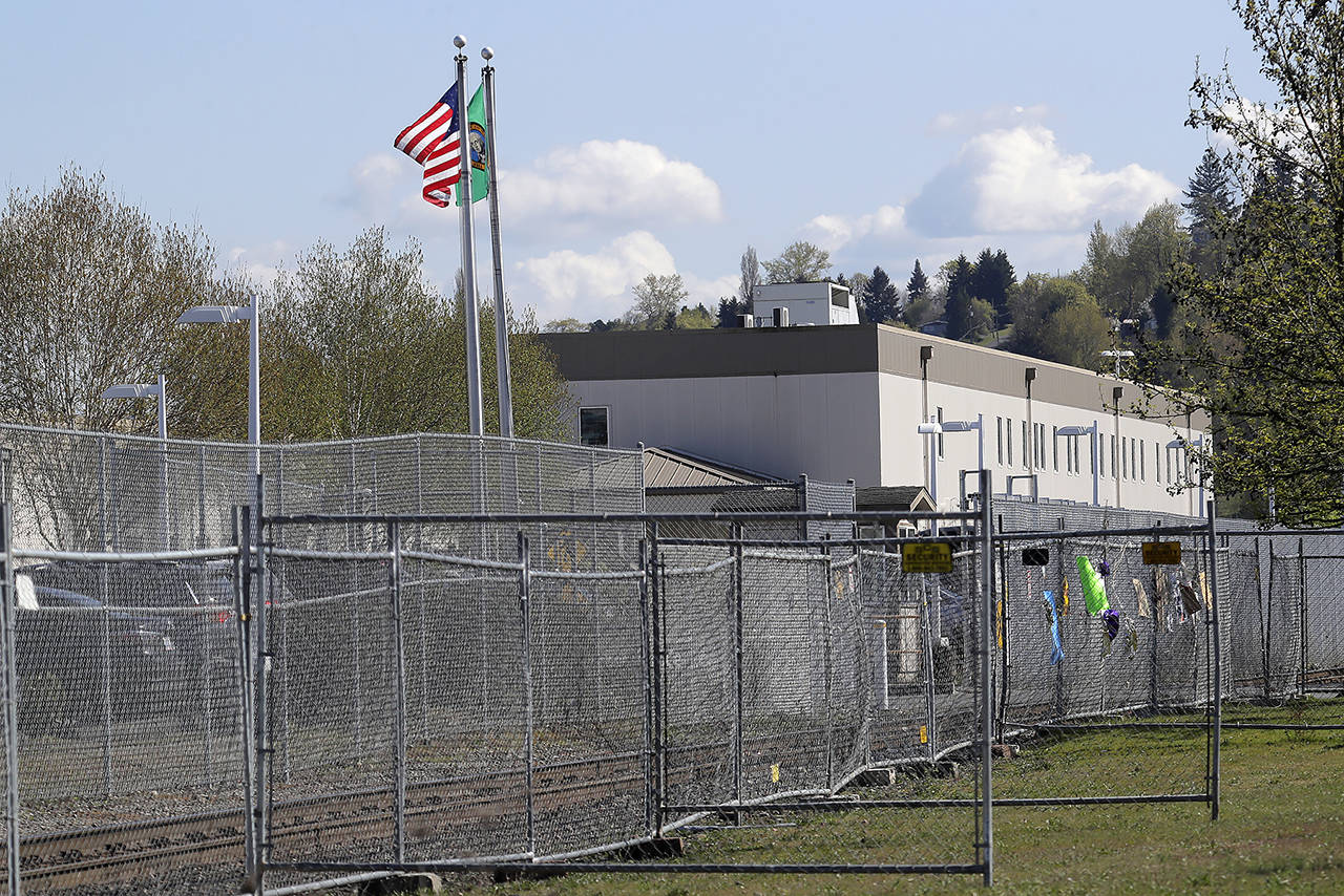 The Northwest Detention Center in Tacoma, seen here in 2020, has seen an outbreak of COVID-19 cases that began in early June. (AP Photo/Ted S. Warren, file)