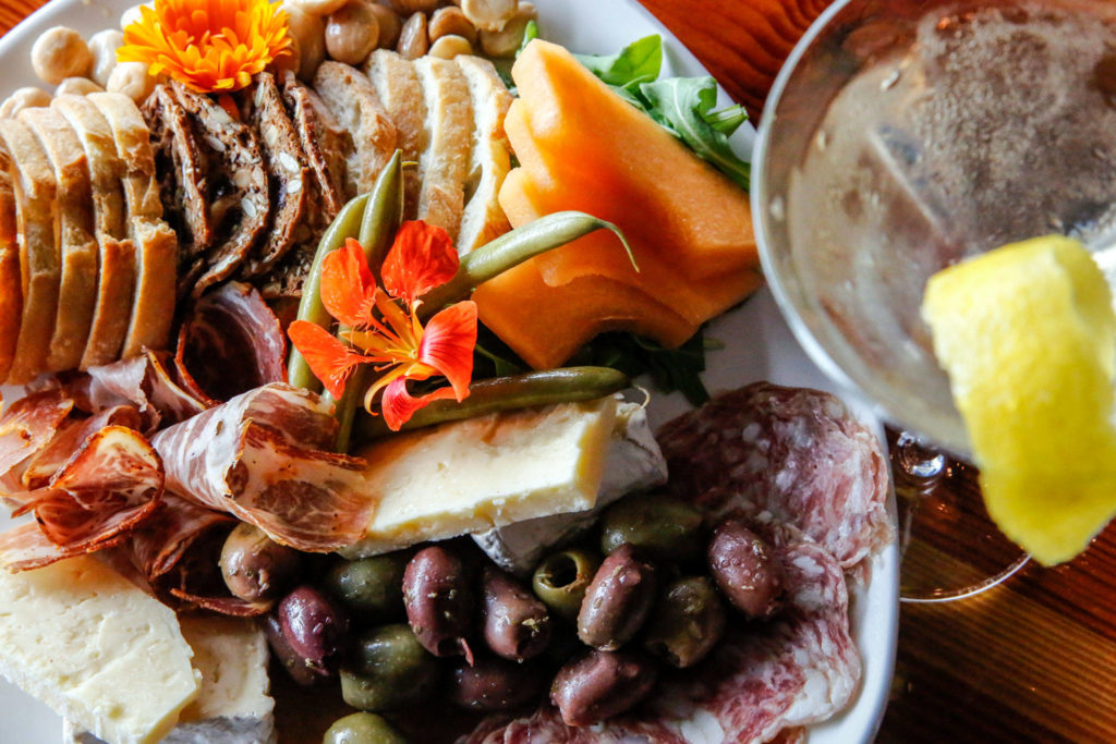 A charcuterie and cheese whole plate sells for $26 at Bluewater Organic Distilling in Everett. (Kevin Clark / The Herald) 

