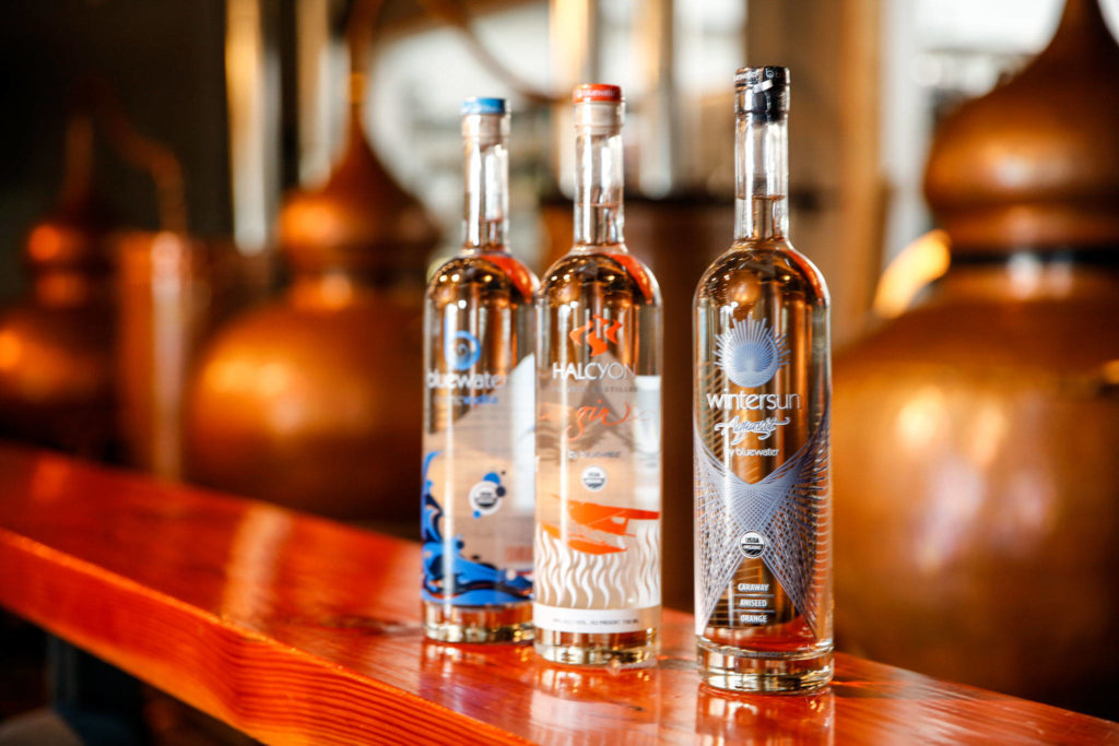From left, Bluewater Vodka, Halcyon Gin and Wintersun Aquavit at Bluewater Organic Distilling in Everett. (Kevin Clark / The Herald) 
