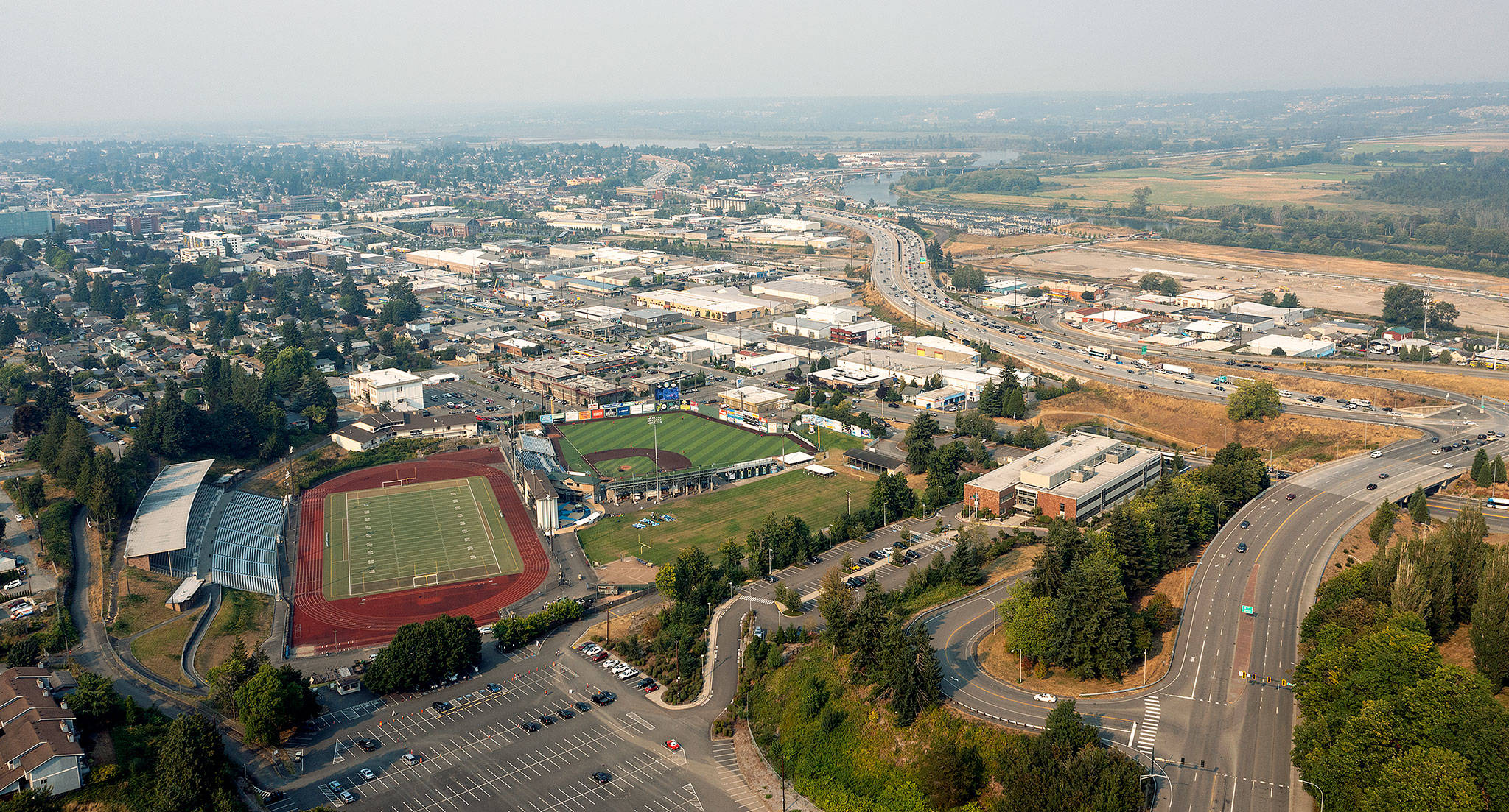 With nary a mountain in sight, the smoke moves in over Memorial Stadium and Everett late Thursday afternoon. (Chuck Taylor / The Herald)