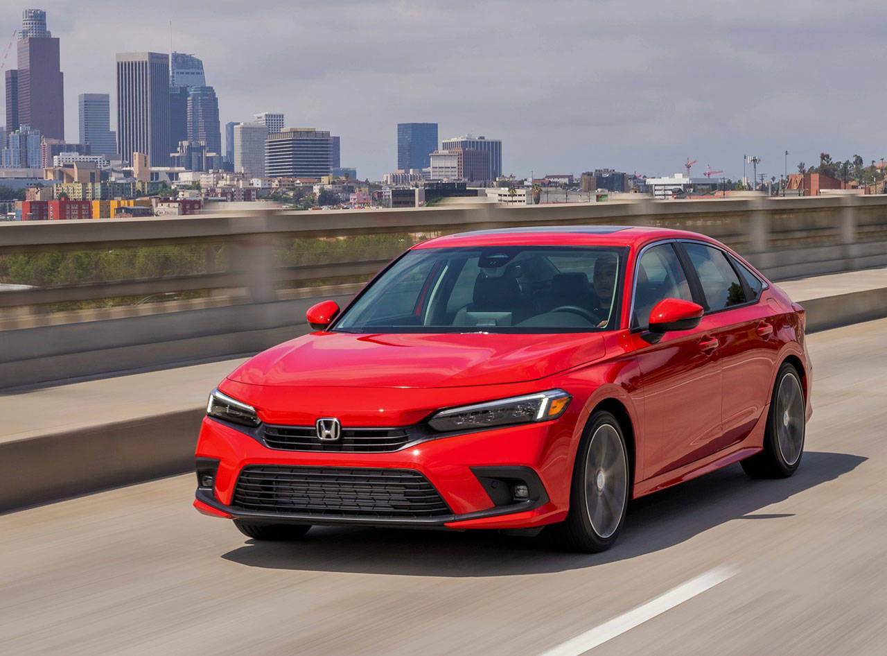 The 2022 Honda Civic Sedan Touring model has a 180-horsepower turbocharged four-cylinder engine joined to a CVT automatic transmission. (Honda)
