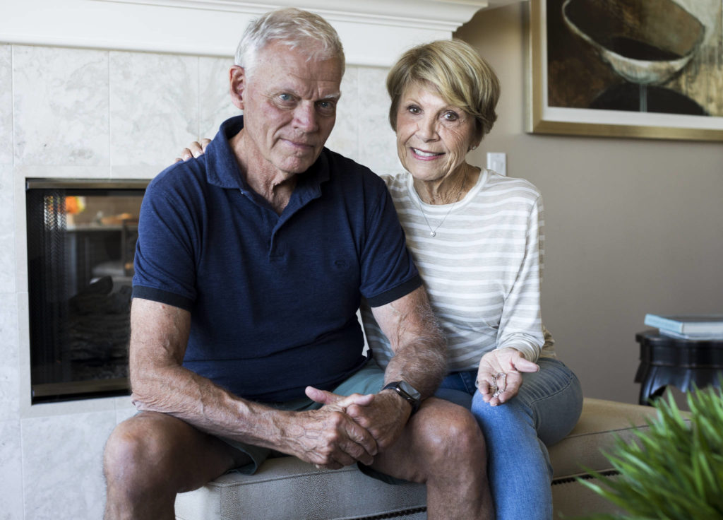 Neal and Colleen Baum with one of her two diamond tennis bracelets that were accidentally thrown out at their home in Edmonds and recovered from five tons of trash. (Olivia Vanni / The Herald)
