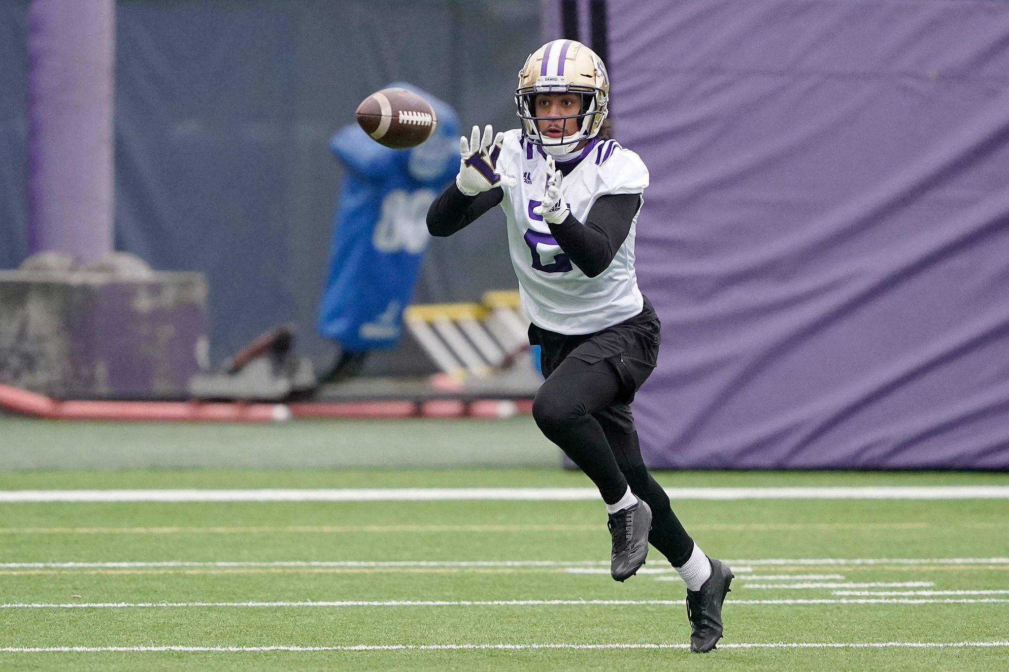 Washington defensive back Kyler Gordon, an Archbishop Murphy alum, makes a catch during practice on April 7, 2021, in Seattle. (AP Photo/Ted S. Warren)