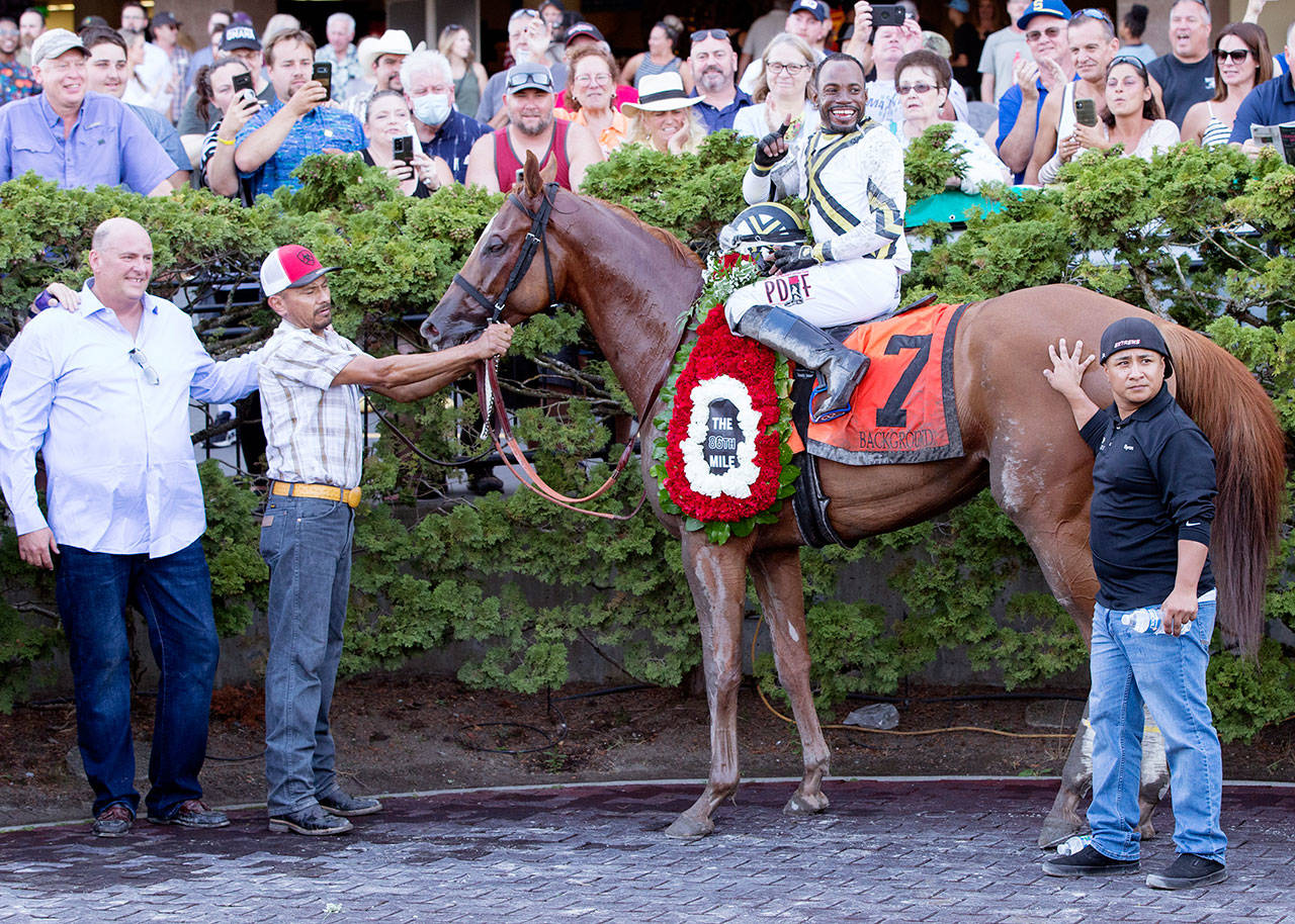 Background, with jockey Rocco Bowen aboard, poses in the winner’s circle after Sunday’s Longacres Mile at Emerald Downs. (Photo courtesy of Emerald Downs)