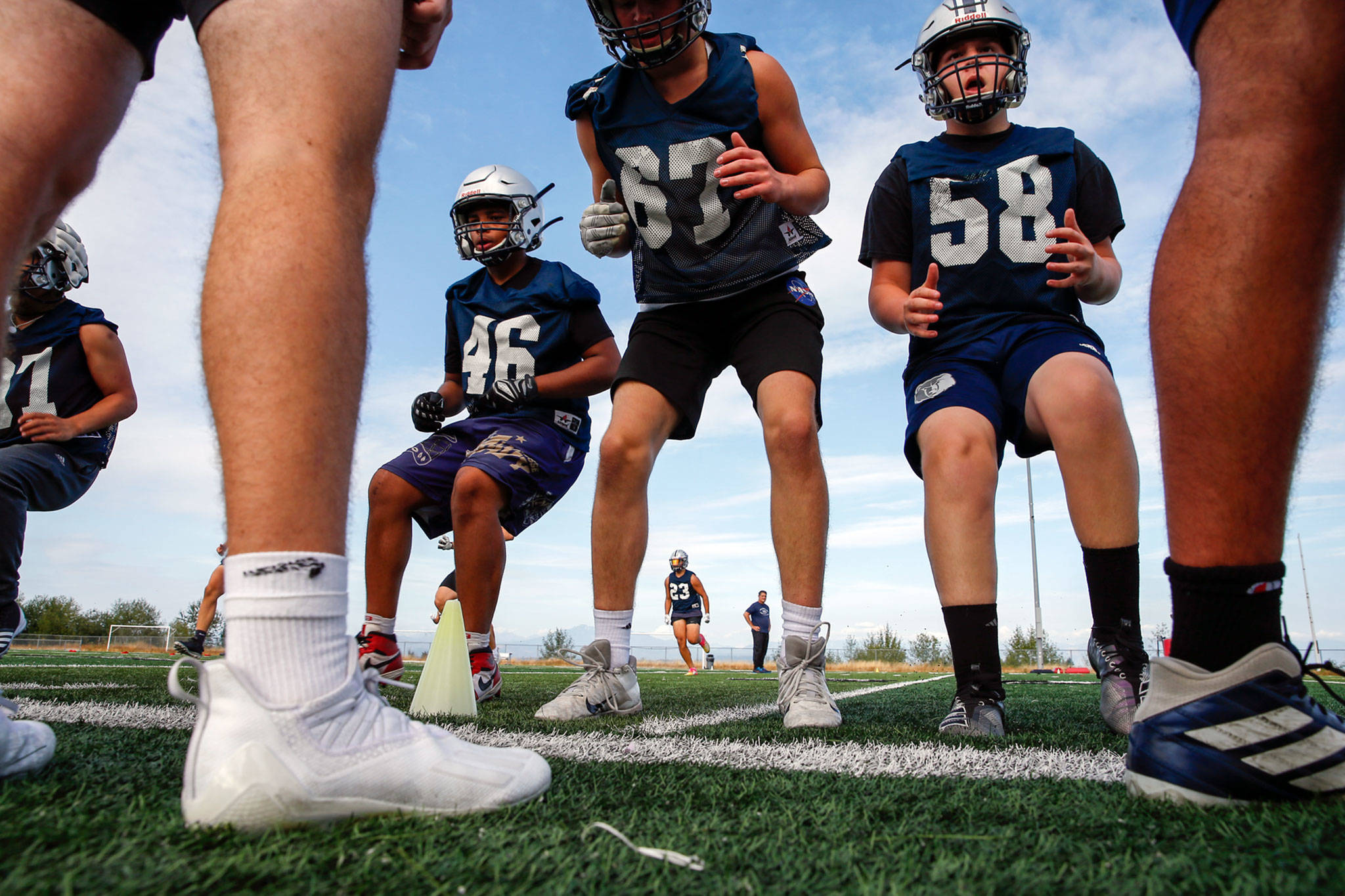 Players run through drills during practice Wednesday afternoon at Glacier Peak High School in Snohomish. (Kevin Clark / The Herald)