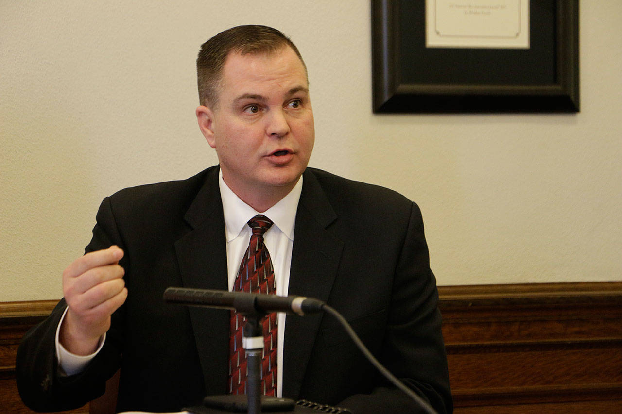 Republican Sen. John Braun, R-Centrailia, talks to the media after Gov. Jay Inslee’s State of the State address in January, 2019. Last week, in criticizing Inslee’s mandate that public school staff be vaccinated for covid-19, Braun said, “No other governor has gone so far to take deeply personal health care choices away from people and force them to inject something into their bodies.” (Rachel La Corte / Associated Press file photo)