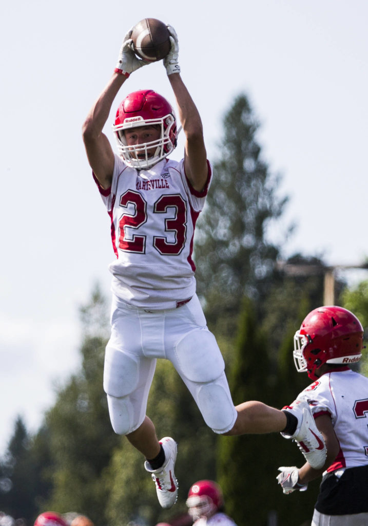 Marysville Pilchuck’s Jaxon Petermeyer jumps to make a catch during football practice on Thursday in Marysville. (Olivia Vanni / The Herald)
