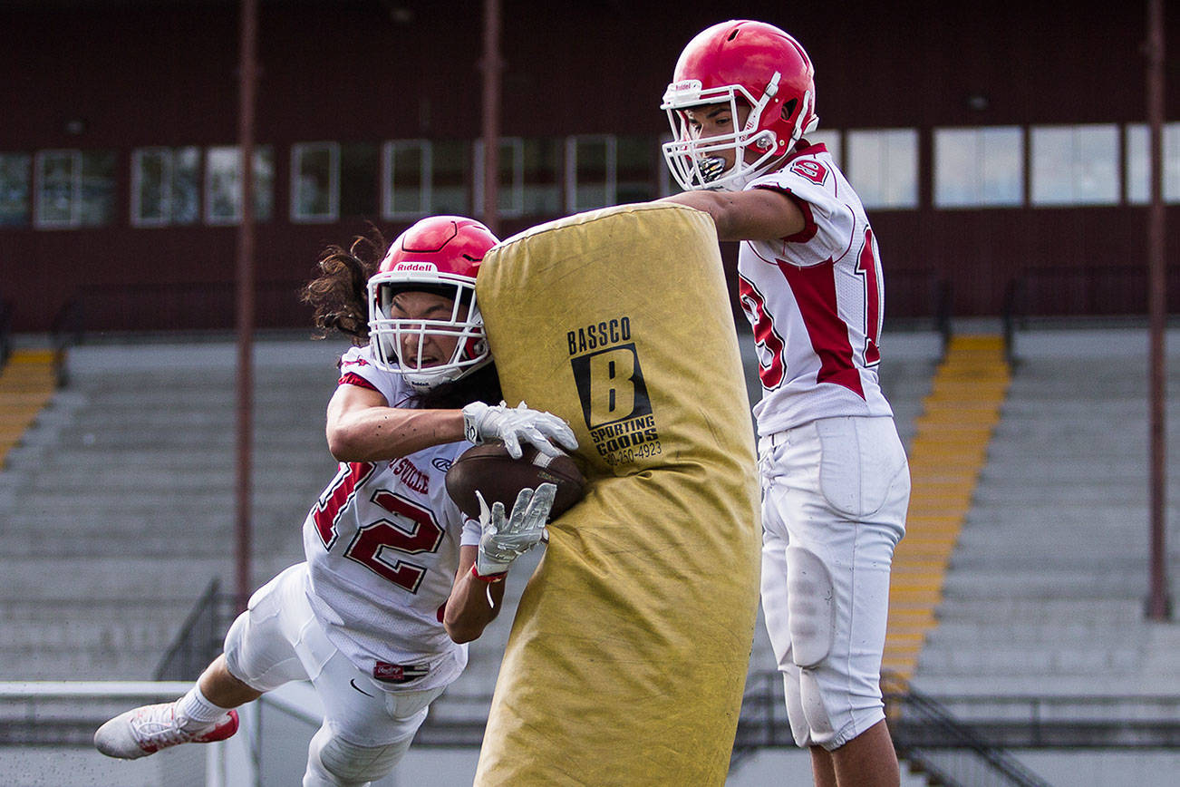 Marysville-Pilchuck’s Carson Asper dives to make a catch during a drill at football practice on Thursday, Aug. 19, 2021 in Marysville, Wash. (Olivia Vanni / The Herald)