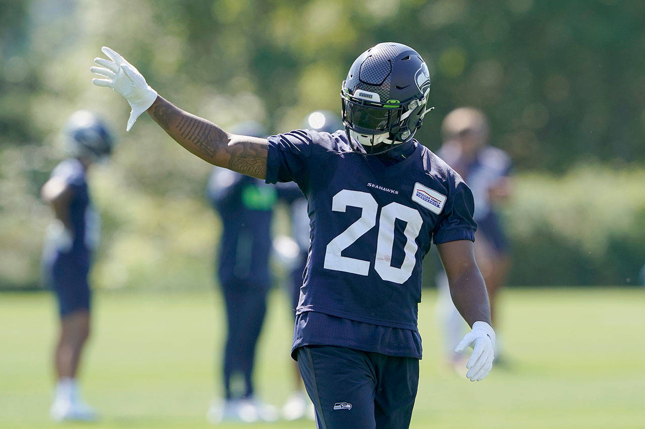 Seattle Seahawks running back Rashaad Penny waves to fans during NFL football practice on July 29 in Renton. (AP Photo/Ted S. Warren)