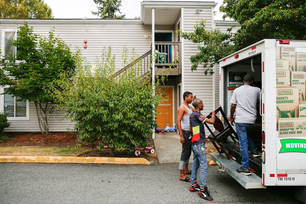 Residents move out of an apartment Wednesday afternoon in the Whispering Pines Complex in Lynnwood on August 25, 2021. (Kevin Clark / The Herald)