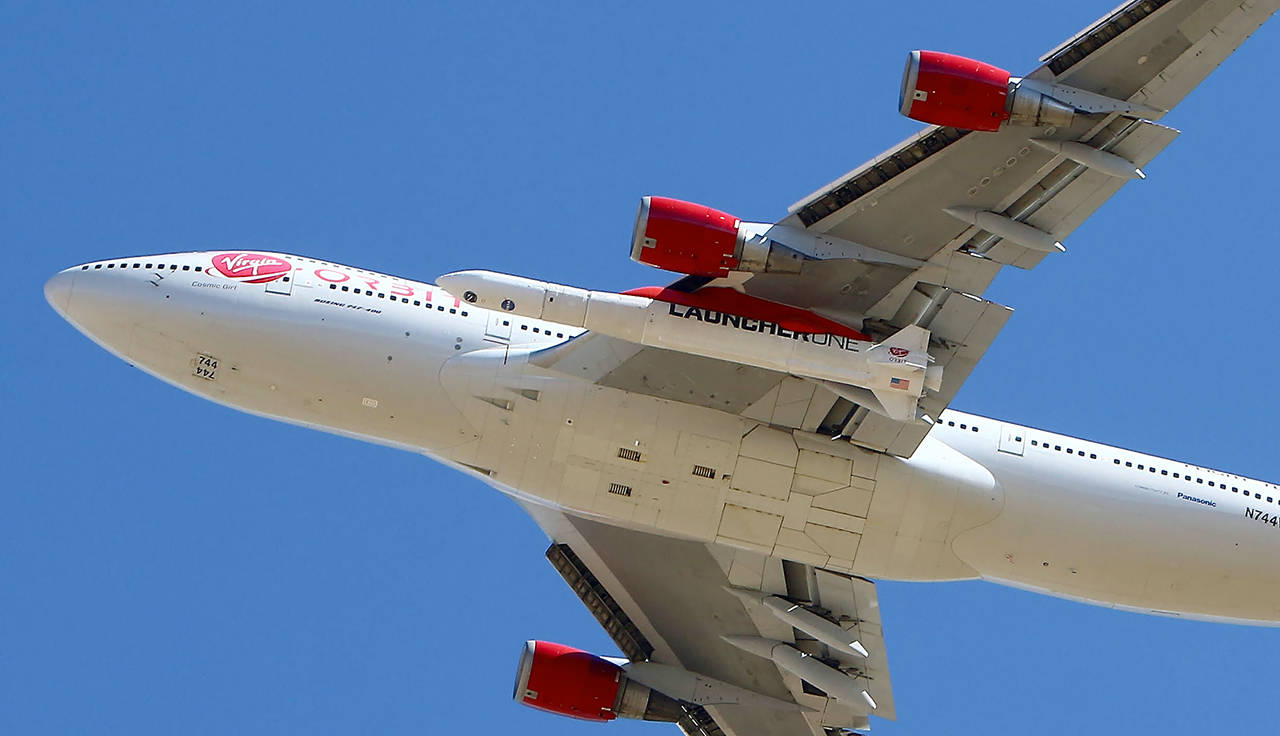 Virgin Orbit Boeing 747-400 rocket launch platform, named Cosmic Girl, takes off from Mojave Air and Space Port, Mojave on its second orbital launch demonstration in the Mojave Desert, north of Los Angeles. (AP Photo/Matt Hartman, file)