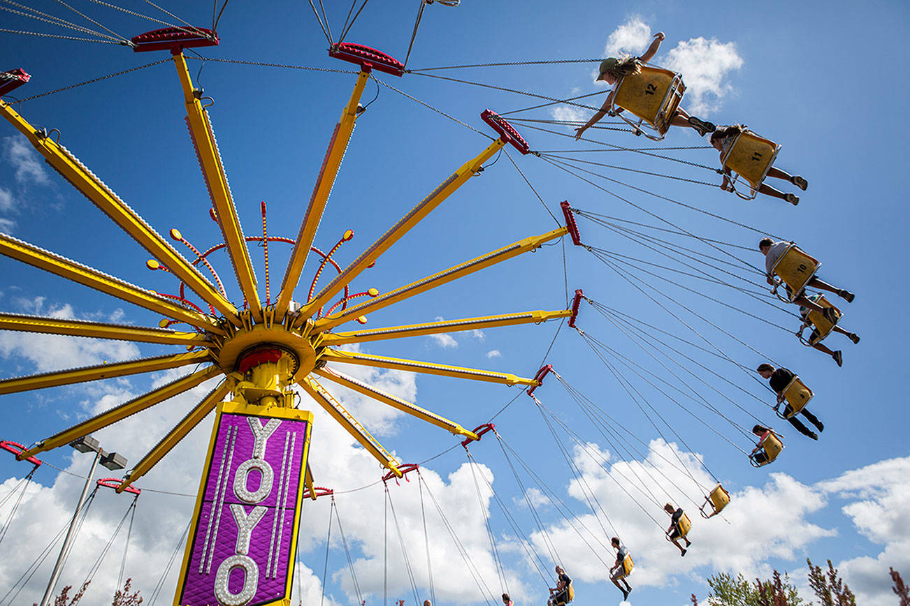 People ride the Yoyo at the Evergreen State Fair on Sunday, Sept. 1, 2019 in Monroe, Wash. (Olivia Vanni / The Herald)