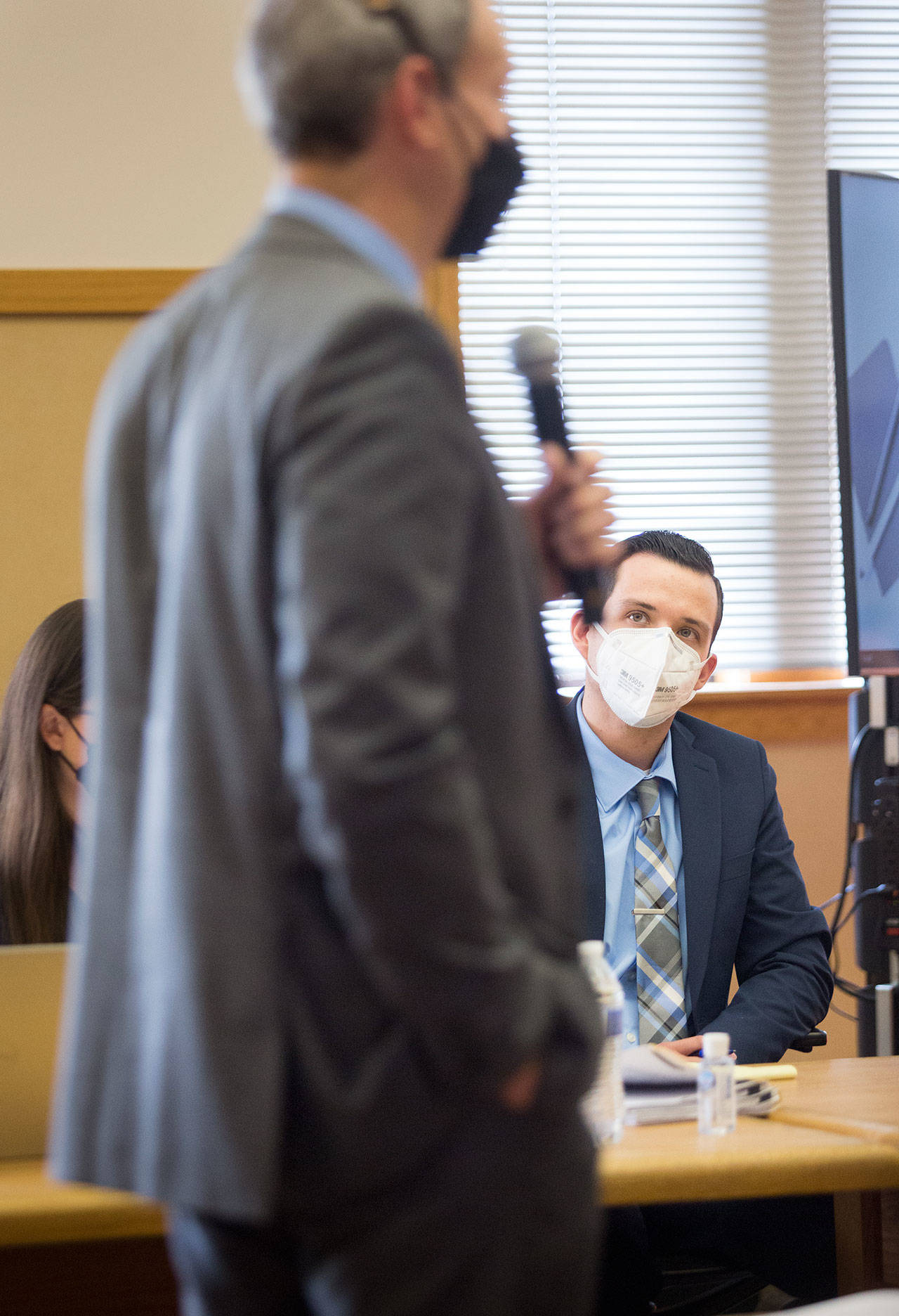 Snohomish County deputy prosecutor Jarett Goodkin gives his opening statement in the trial of former Snohomish County sheriff’s deputy Anthony Zayas (right) at Snohomish County Courthouse on Wednesday in Everett. (Andy Bronson / The Herald)