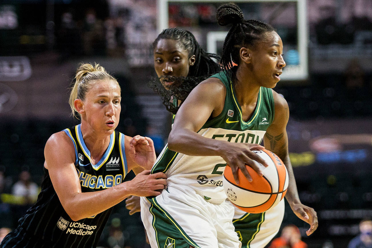 Seattle Storm’s Jewell Loyd has her jersey grabbed by at Chicago Sky’s Courtney Vandersloot during the game at Angel of the Winds Arena on Friday, Aug. 27, 2021 in Everett, Wash. (Olivia Vanni / The Herald)