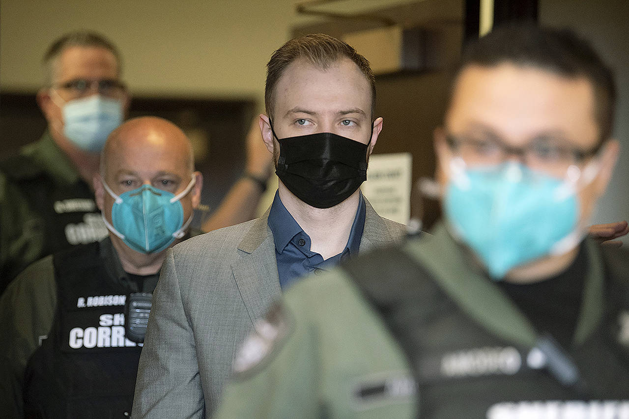 Defendant David Bogdanov is escorted into the courtroom for the verdict in his trial at the Clark County Courthouse in Vancouver, Washington, on Aug. 27. Bogdanov was found guilty of second-degree murder and malicious harassment in the death of transgender teen, Nikki Kuhnhausen. (Amanda Cowan/The Columbian via AP)