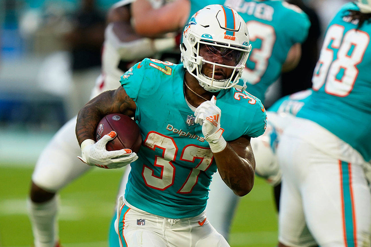 Miami Dolphins running back Myles Gaskin (37) runs the ball, during the first half of a NFL preseason football game against the Atlanta Falcons, Saturday, Aug. 21, 2021, in Miami Gardens, Fla. (AP Photo/Wilfredo Lee)