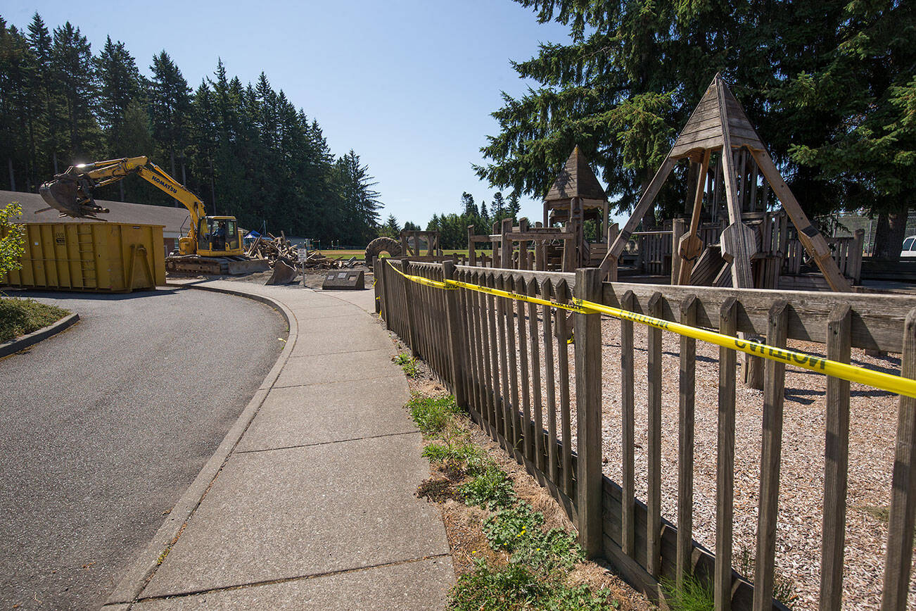 In July, Lake Stevens Public Works crews demolished a wooden castle playground adjacent to Mount Pilchuck Elementary. The department of Labor and Industries cited the city for a series of workplace safety violations earlier this year, which the city has appealed. (Andy Bronson / The Herald)